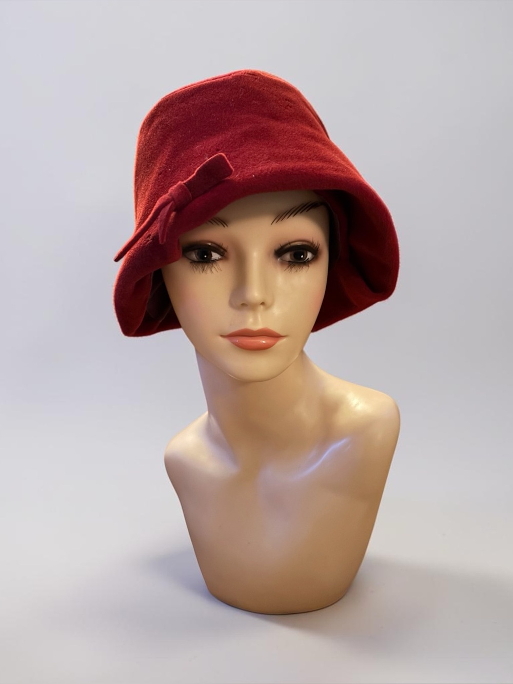 Vintage red wool felt cloche hat detailed with a matching side bow